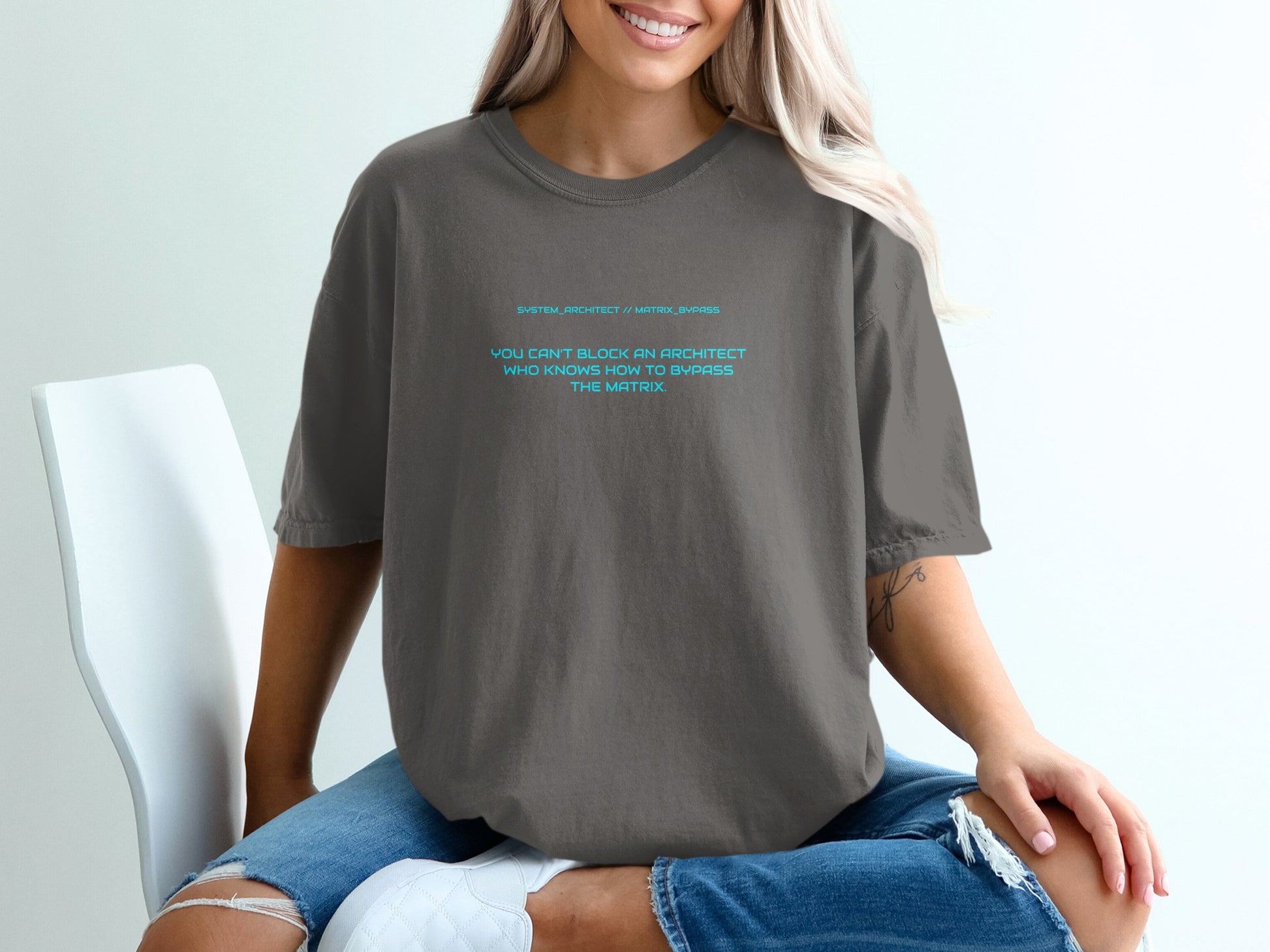 Dark grey t-shirt with "System Architect // Matrix Bypass" and motivational text.
